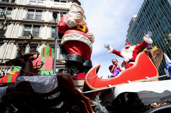 Santa's float journeys down Queen Street in the 2011 Farmers Santa Parade.